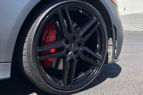 5 Signs It's Time for Brake Service and Repair | Ace Performance Automotive in Gilbert & Queen Creek, AZ. Image of a car on halt, focusing on the tires.