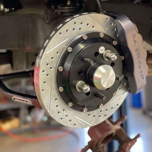5 Signs It's Time for Brake Service and Repair | Ace Performance Automotive in Gilbert & Queen Creek, AZ. Image of a brake rotor and brake caliper.
